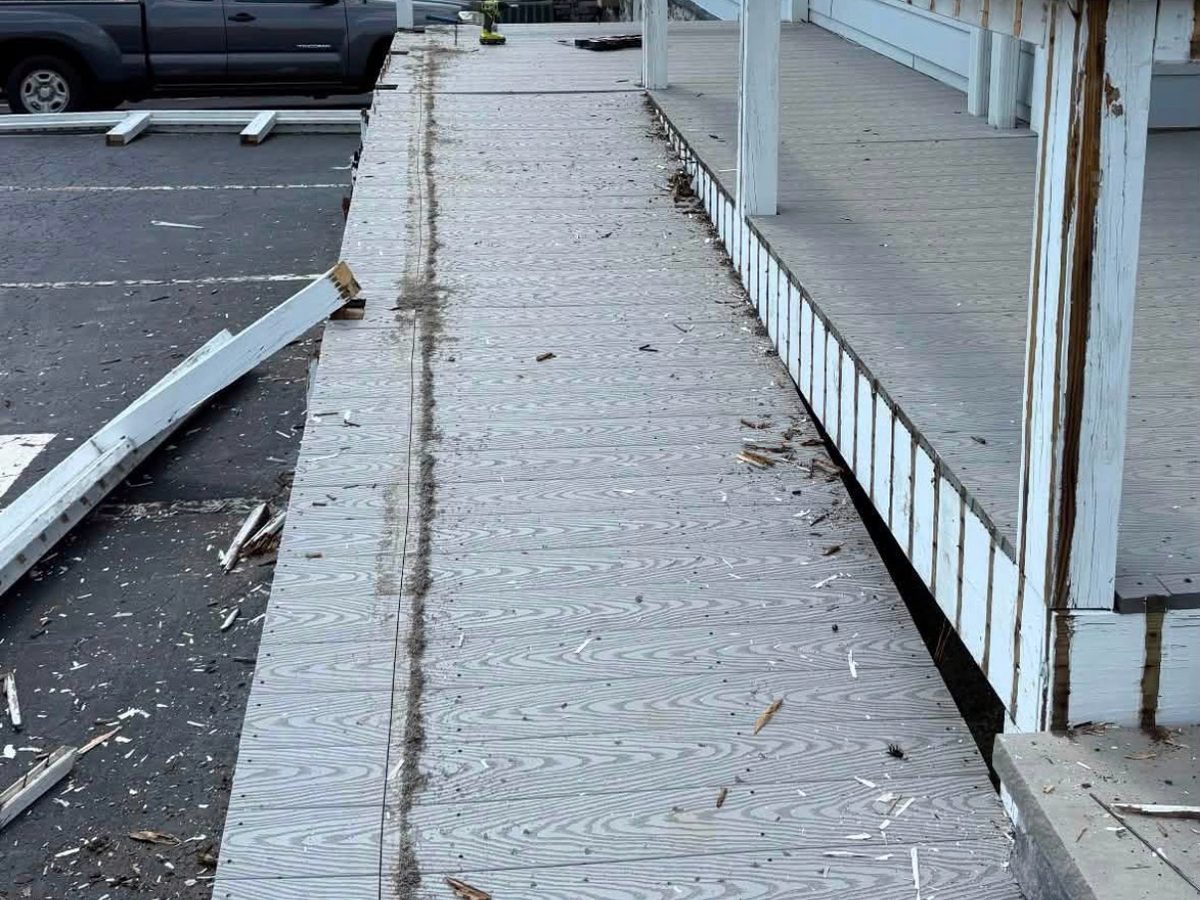 Before: a worn, damaged ramp with broken railings